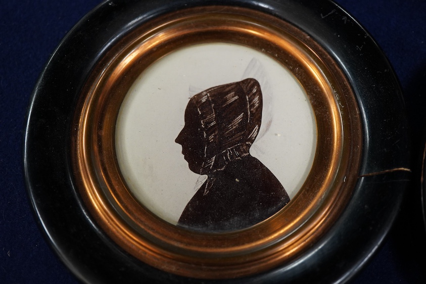Four mid 19th century Irish hand painted silhouette portraits to include two of Sarah Woods, neé Walsh, wife of James Woods of Kilwarlin and one of Sarah Lawton, wife of Samuel Moss, largest 9.5 x 6.5cm, each framed